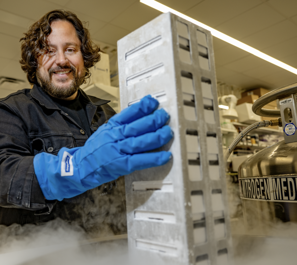 ben lamm holds some of the frozen repository in a lab